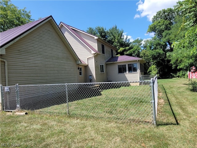 view of property exterior featuring a yard