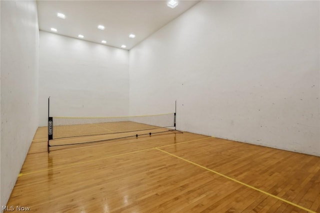 view of property's community with tennis court
