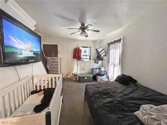 carpeted bedroom featuring ceiling fan