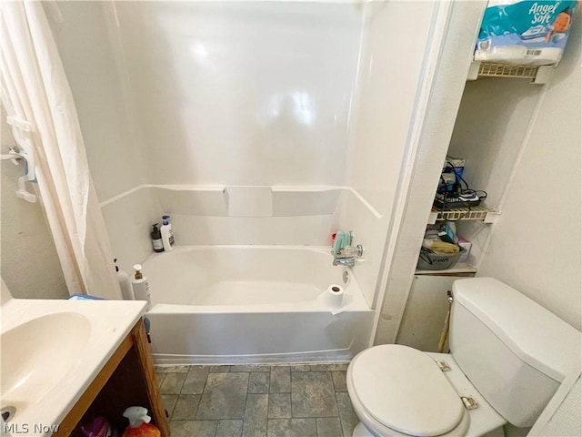 full bathroom with toilet, vanity, and shower / tub combo with curtain