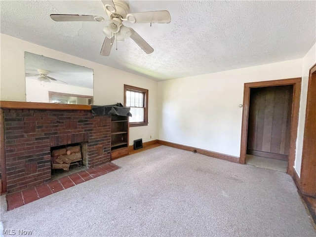 living room featuring carpet floors, a fireplace, and a textured ceiling