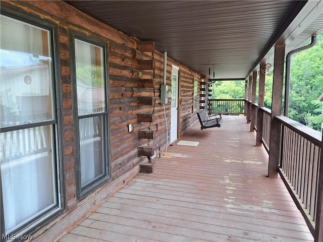 wooden terrace with a porch