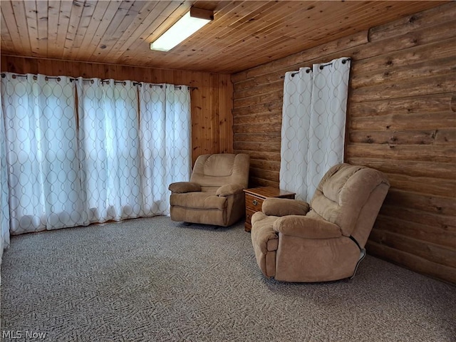 living area featuring carpet, wooden ceiling, and log walls