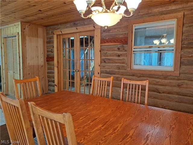 unfurnished dining area featuring wood ceiling, a notable chandelier, log walls, and french doors