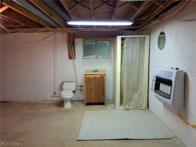 unfinished basement featuring a sink and heating unit