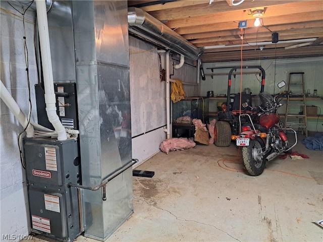 interior space with concrete block wall and heating unit