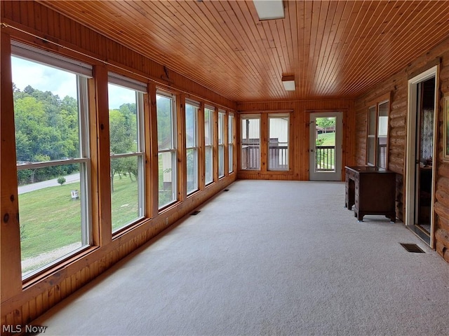 unfurnished sunroom with wooden ceiling and visible vents