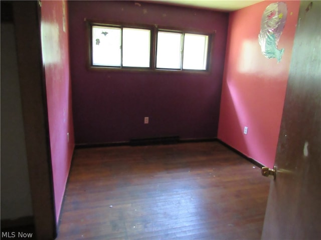 spare room featuring hardwood / wood-style flooring