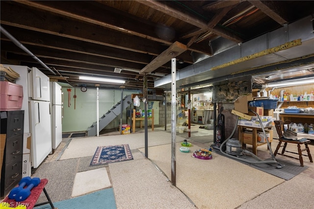 basement featuring light colored carpet