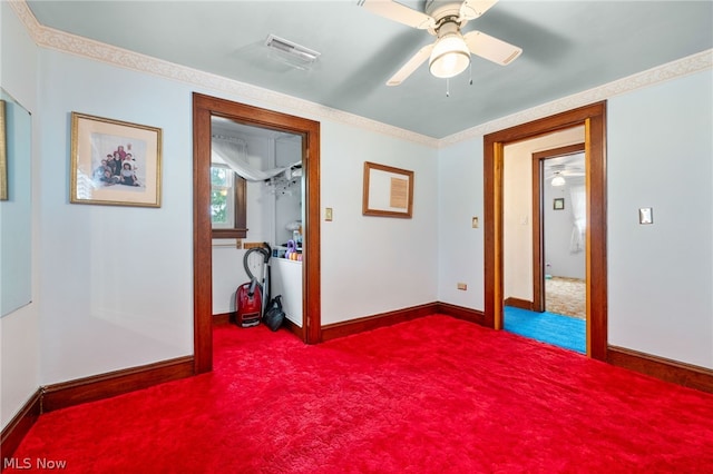 carpeted empty room featuring ceiling fan