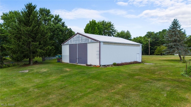 view of outbuilding featuring a lawn