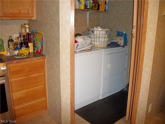 laundry room featuring washer and dryer and bar