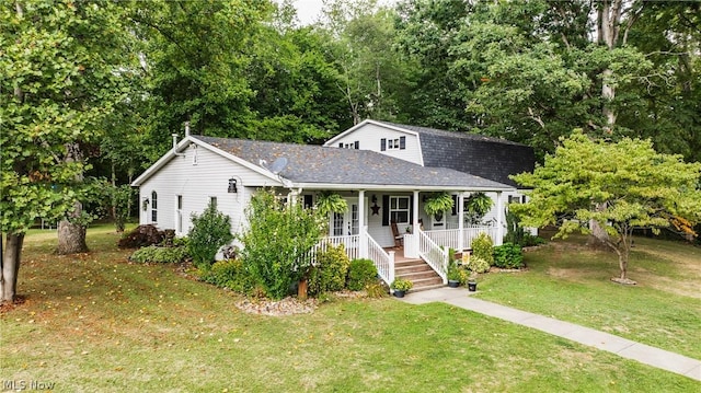 view of front of property with covered porch and a front lawn