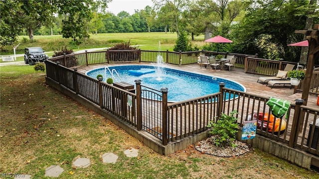 view of swimming pool featuring a deck