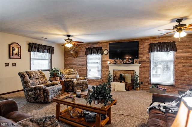 carpeted living room featuring ceiling fan