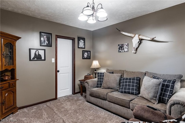 living room with carpet floors, a textured ceiling, and an inviting chandelier