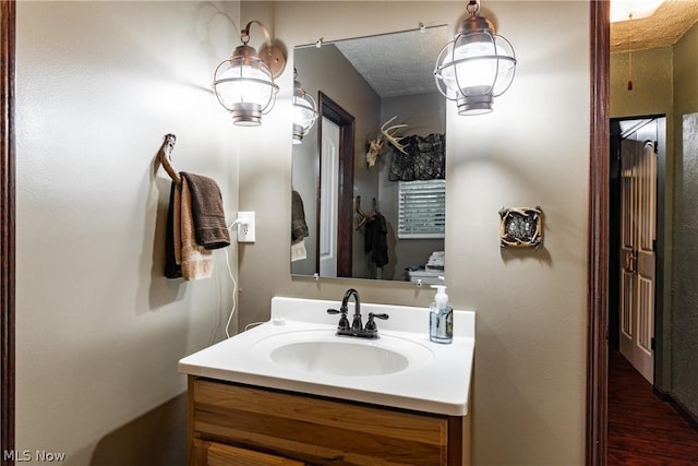 bathroom featuring vanity and a textured ceiling