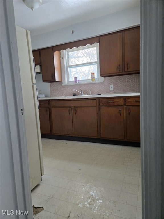 kitchen with sink and dark brown cabinets