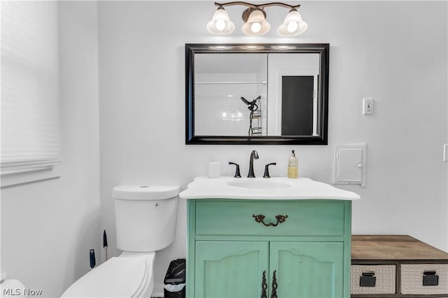 bathroom with a shower, toilet, and vanity