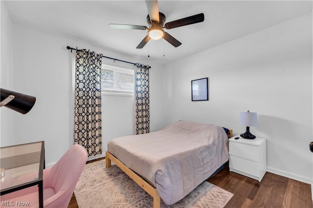 bedroom featuring dark hardwood / wood-style floors and ceiling fan