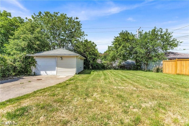 view of yard with a garage and an outdoor structure