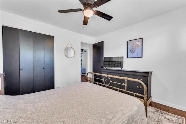 bedroom with a closet, ceiling fan, and hardwood / wood-style flooring