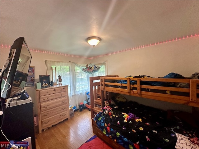 bedroom with light hardwood / wood-style floors