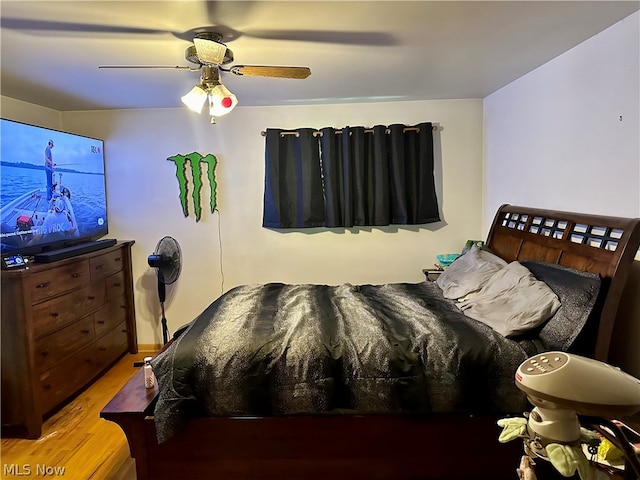 bedroom featuring hardwood / wood-style flooring and ceiling fan