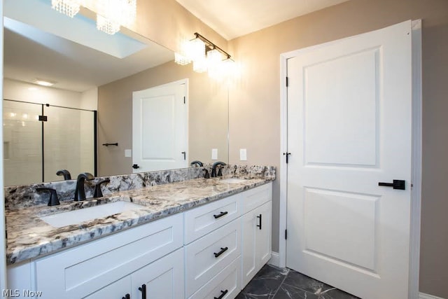 bathroom with vanity and an enclosed shower