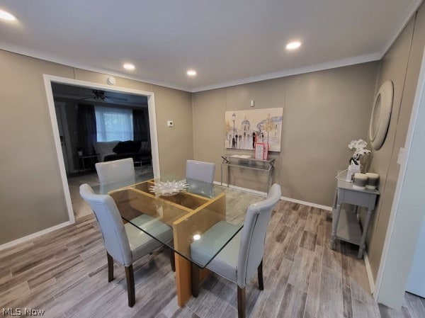 dining room featuring ornamental molding, ceiling fan, and hardwood / wood-style floors