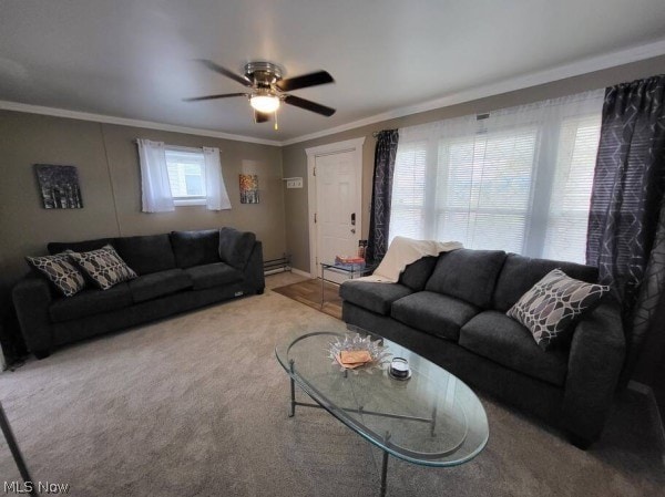 carpeted living room with ornamental molding, a baseboard heating unit, and ceiling fan