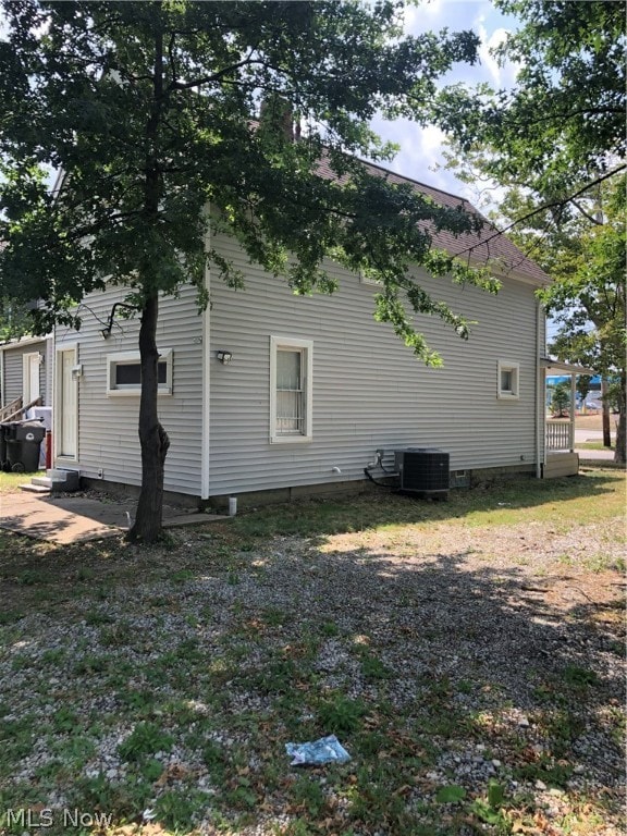 back of property with central AC