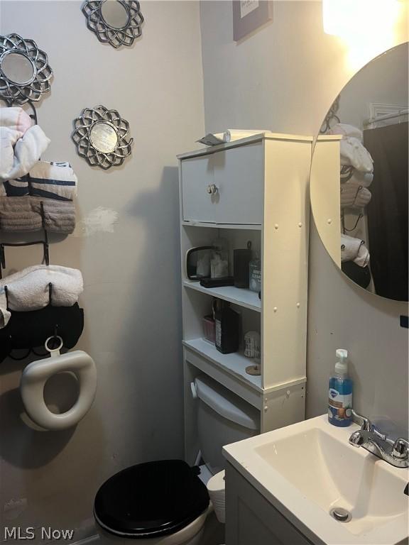 bathroom with vanity and toilet