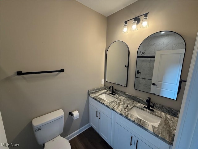 14501 Kennerdown Ave, Maple Heights, OH 44137 - bathroom with double vanity, tiled shower, and wood finished floors