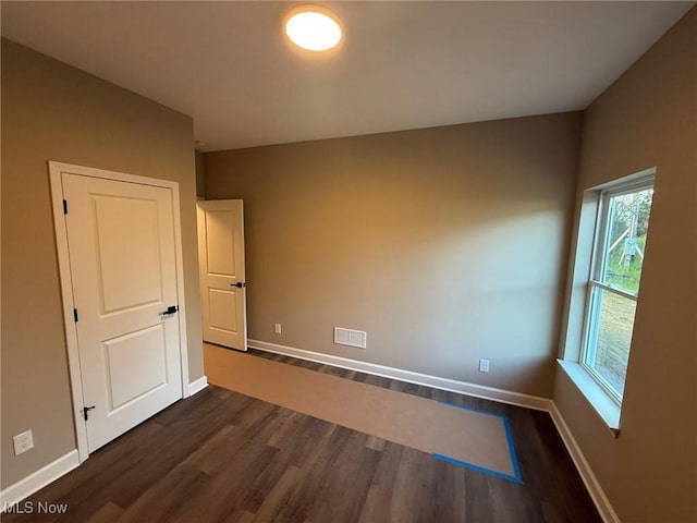 17204 Maple Heights Blvd, Maple Heights, OH 44137 - unfurnished room featuring dark wood-type flooring