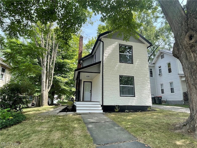 view of front property with a front lawn