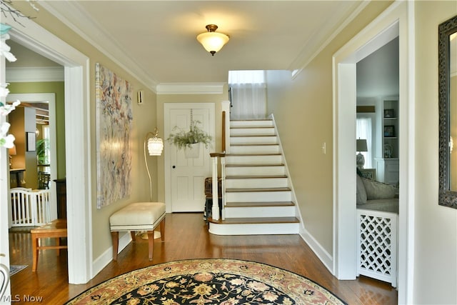 entrance foyer with hardwood / wood-style flooring and ornamental molding