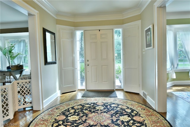 entryway featuring hardwood / wood-style flooring and ornamental molding