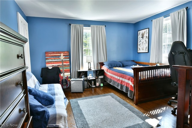 bedroom featuring dark wood-type flooring