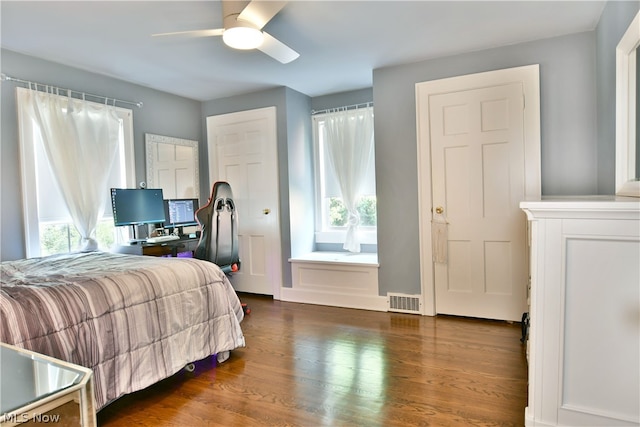 bedroom featuring hardwood / wood-style floors and ceiling fan