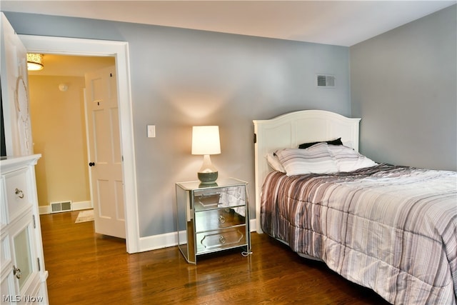 bedroom featuring dark hardwood / wood-style floors