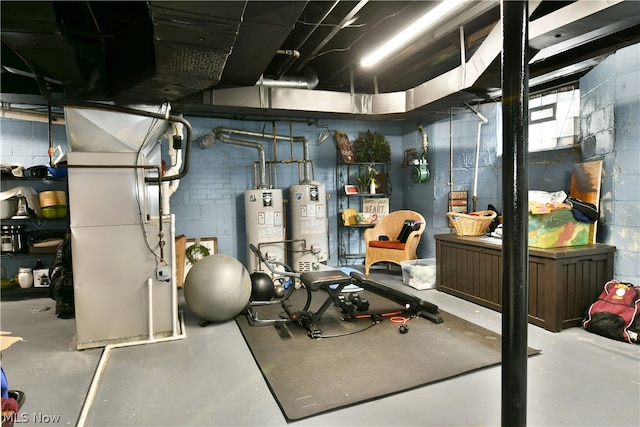 exercise area with concrete flooring and gas water heater