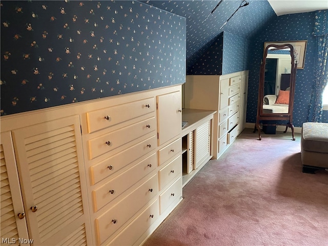 bedroom with carpet flooring and vaulted ceiling