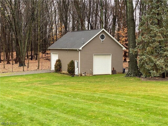 garage with a lawn