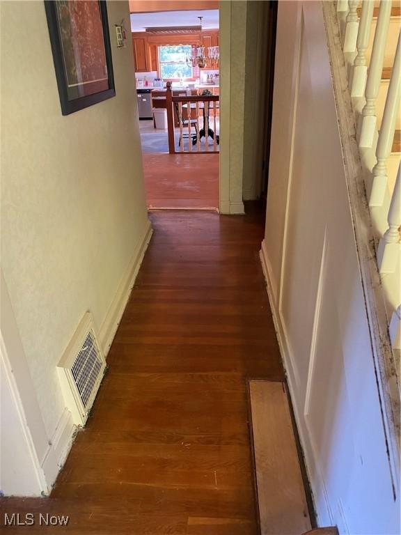 hall with dark hardwood / wood-style flooring