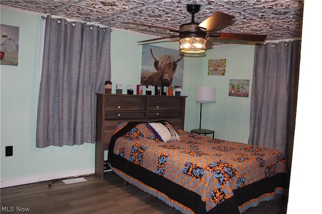 bedroom featuring wood-type flooring and ceiling fan