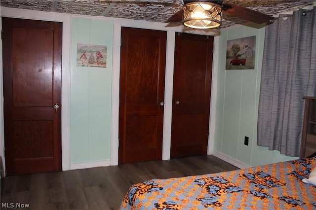 unfurnished bedroom featuring dark hardwood / wood-style floors