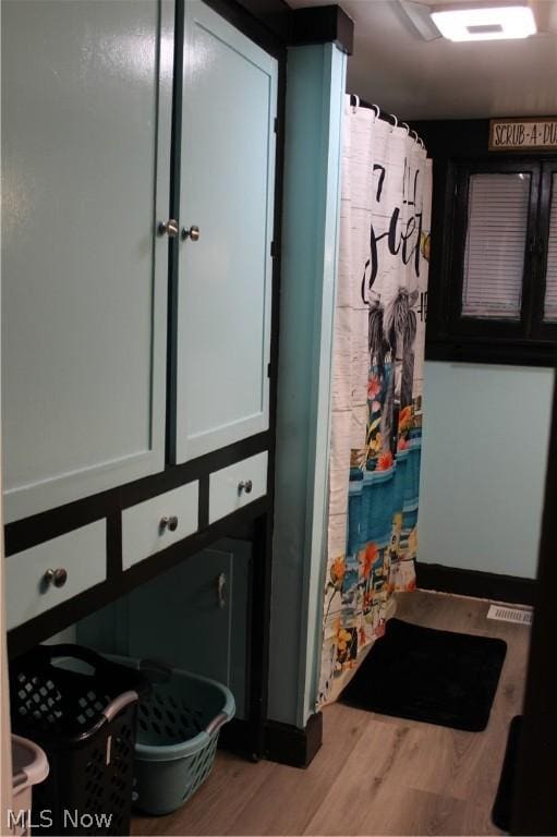 bathroom with hardwood / wood-style flooring