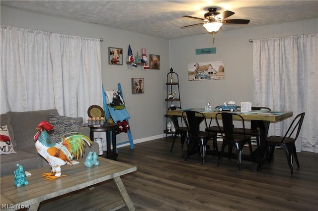 dining room featuring ceiling fan, dark hardwood / wood-style flooring, and a textured ceiling