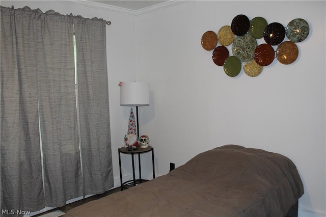 bedroom with ornamental molding